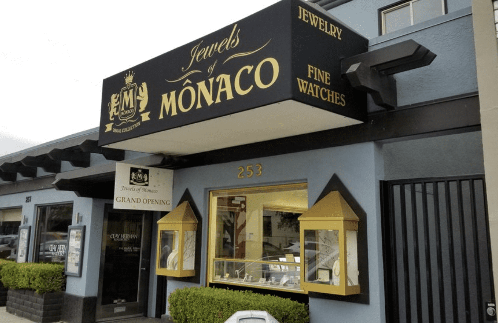 Store front Exterior of "Jewels of MONACO" jewelry store with display windows and signage